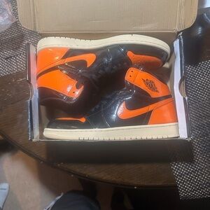 Jordan High-Top Sneakers in Black and Orange
